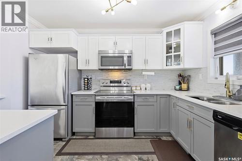 263 250 Akhtar Bend, Saskatoon, SK - Indoor Photo Showing Kitchen With Stainless Steel Kitchen With Double Sink With Upgraded Kitchen