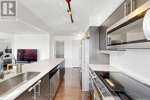 Gourmet Kitchen feature Stainless Steel Appliances - #710 - 125 Western Battery Road, Toronto, ON - Indoor Photo Showing Kitchen With Upgraded Kitchen