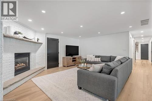 18 Fox Run Drive, Puslinch, ON - Indoor Photo Showing Living Room With Fireplace