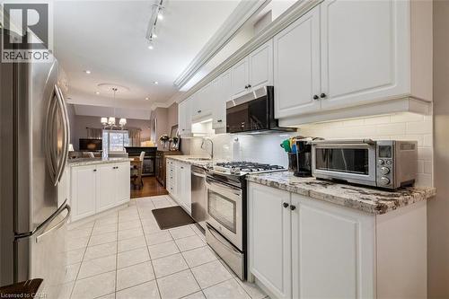Gorgeous White Kitchen with Granite Counters! - 1019 North Shore Boulevard E Unit# 3, Burlington, ON - Indoor Photo Showing Kitchen With Stainless Steel Kitchen With Upgraded Kitchen