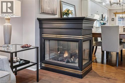 Two Way Fireplace between Living/Dining Rooms - 1019 North Shore Boulevard E Unit# 3, Burlington, ON - Indoor
