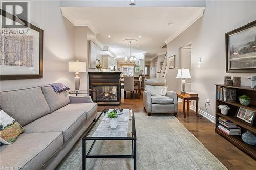 Open Concept! - 1019 North Shore Boulevard E Unit# 3, Burlington, ON - Indoor Photo Showing Living Room With Fireplace