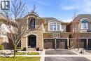 French country home featuring a garage, stone siding, driveway, a standing seam roof, and stucco siding - 4670 Bracknell Road, Burlington, ON  - Outdoor With Facade 