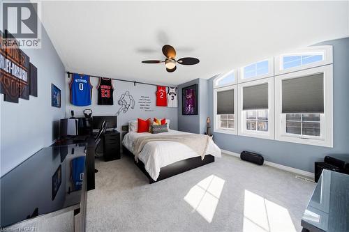 Carpeted bedroom with ceiling fan and baseboards - 4670 Bracknell Road, Burlington, ON - Indoor Photo Showing Bedroom