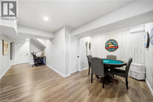 Dining space featuring a desk, wood finished floors, and wooden walls - 4670 Bracknell Road, Burlington, ON - Indoor Photo Showing Other Room