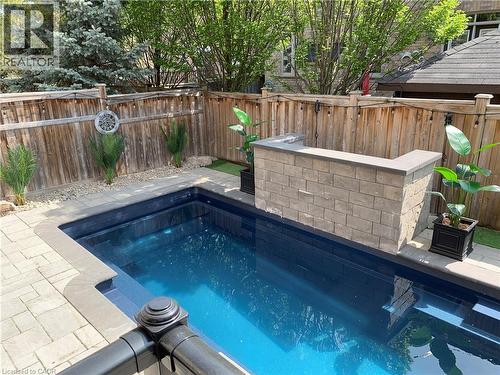 View of pool with a fenced backyard and patio surround - 4670 Bracknell Road, Burlington, ON - Outdoor With In Ground Pool With Deck Patio Veranda