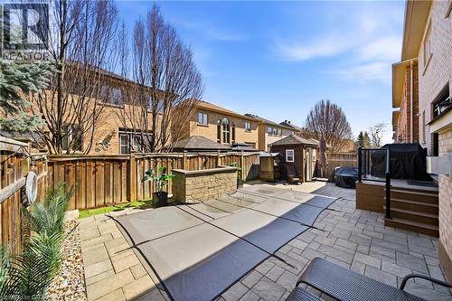 Fenced backyard with a residential view, a patio area, area for grilling, and a shed - 4670 Bracknell Road, Burlington, ON - Outdoor With Exterior