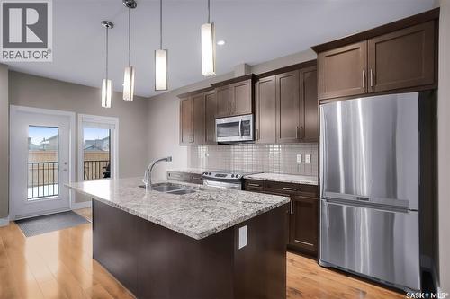 48 1550 Paton Crescent, Saskatoon, SK - Indoor Photo Showing Kitchen With Stainless Steel Kitchen With Double Sink With Upgraded Kitchen