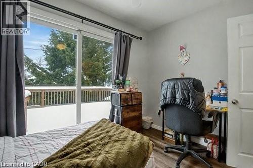 Bedroom featuring wood finished floors and a desk - 11 Carwyn Crescent, Hamilton, ON - Indoor Photo Showing Bedroom