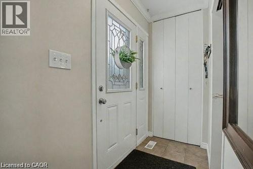 Doorway to outside featuring ornamental molding and tile patterned flooring - 11 Carwyn Crescent, Hamilton, ON - Indoor Photo Showing Other Room