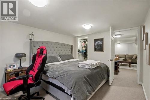 Bedroom featuring a spacious closet and light colored carpet - 11 Carwyn Crescent, Hamilton, ON - Indoor Photo Showing Bedroom