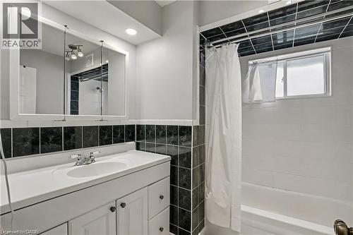 Bathroom with vanity, tile walls, and shower / bath combination with curtain - 11 Carwyn Crescent, Hamilton, ON - Indoor Photo Showing Bathroom