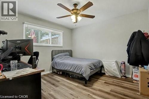 Bedroom with light wood-style floors and ceiling fan - 11 Carwyn Crescent, Hamilton, ON - Indoor Photo Showing Bedroom