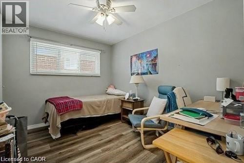 Bedroom featuring wood finished floors, a desk, and a ceiling fan - 11 Carwyn Crescent, Hamilton, ON - Indoor Photo Showing Other Room
