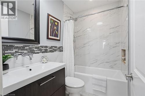 Entry WELCOME'S YOU HOME; featuring hardwood floors and lovely millwork. Tall doors, crown molding & MORE! - 208 East 44Th Street, Hamilton, ON - Indoor Photo Showing Bathroom