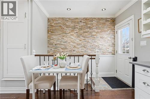 Primary bedroom features plenty of natural light, large closet & gleaming hardwood floors. - 208 East 44Th Street, Hamilton, ON - Indoor Photo Showing Dining Room