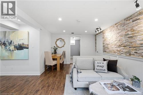 Family room is BRIGHT & BEAUTIFUL with gleaming laminate wood floors and recessed lighting & a stellar space. - 208 East 44Th Street, Hamilton, ON - Indoor