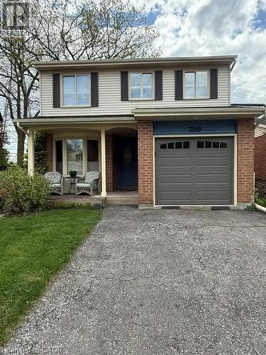 Welcome to this Beautifully maintained spacious 5-level backsplit featuring an inviting covered front porch - 3200 Greenbough Crescent, Burlington, ON - Outdoor With Deck Patio Veranda