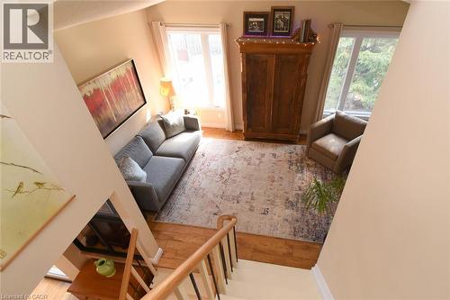 Living area featuring large windows that fill the room with natural light - 3200 Greenbough Crescent, Burlington, ON - Indoor