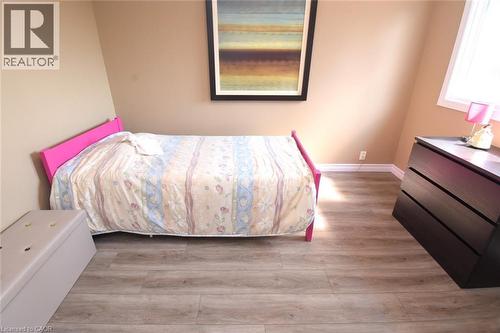 Second Bedroom featuring large window and closets - 3200 Greenbough Crescent, Burlington, ON - Indoor Photo Showing Bedroom