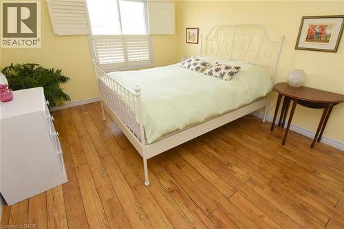 Third bedroom featuring large window with shutters - 3200 Greenbough Crescent, Burlington, ON - Indoor Photo Showing Bedroom