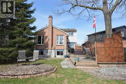 Back of property featuring a private multi-level deck, and a hot tub - 3200 Greenbough Crescent, Burlington, ON - Outdoor