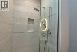Bathroom featuring a shower stall - 