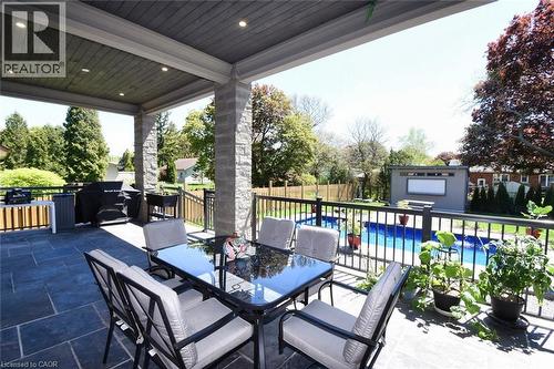 View of patio with outdoor dining area and an outbuilding - 68 Mountain Brow Boulevard, Hamilton, ON - Outdoor With In Ground Pool With Deck Patio Veranda With Exterior