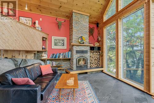 139 Manitou Drive, Mckellar, ON - Indoor Photo Showing Living Room With Fireplace