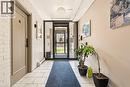 Entryway with brick wall and light tile patterned floors - 2373 E King Street E Unit# 45, Hamilton, ON  - Indoor Photo Showing Other Room 