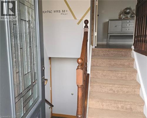 Stairway with baseboards and wood finished floors - 67 Pinemeadow Crescent, Waterloo, ON - Indoor Photo Showing Other Room