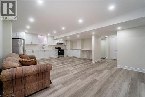Living room with light wood-type flooring and recessed lighting - 150 Goodwin Crescent Unit# Bsmt, Milton, ON - Indoor