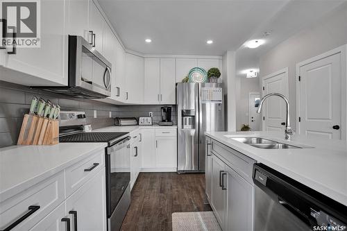 134 Germain Court, Saskatoon, SK - Indoor Photo Showing Kitchen With Stainless Steel Kitchen With Double Sink With Upgraded Kitchen