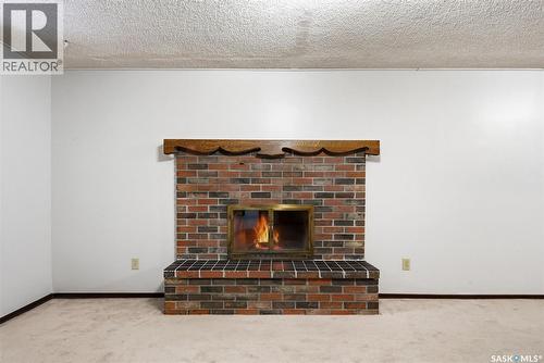 30 Dalhousie Way, Regina, SK - Indoor With Fireplace