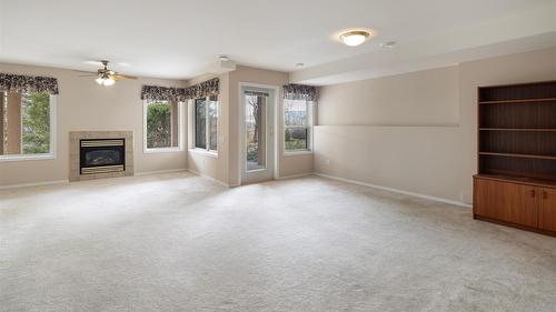 14-2300 Silver Place, Kelowna, BC - Indoor Photo Showing Other Room With Fireplace