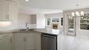 14-2300 Silver Place, Kelowna, BC  - Indoor Photo Showing Kitchen With Double Sink 
