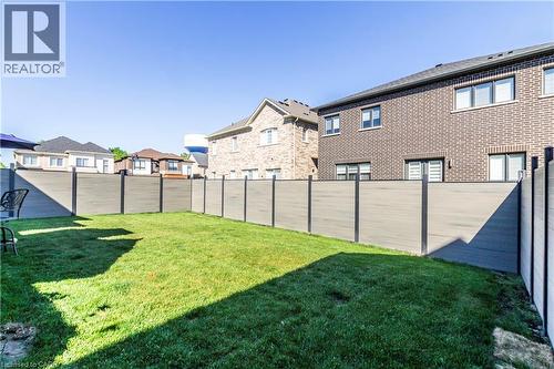 Fenced backyard featuring a residential view - 72 Pond View Gate, Waterdown, ON - Outdoor