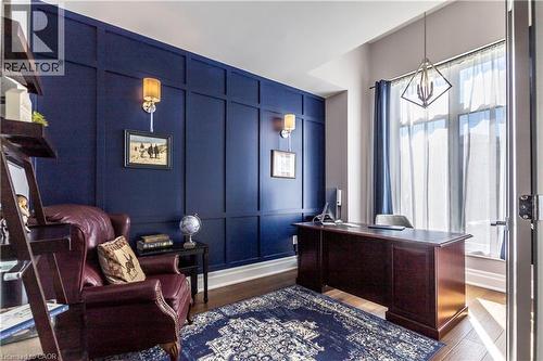 Office space with a decorative wall and dark wood-style flooring - 72 Pond View Gate, Waterdown, ON - Indoor