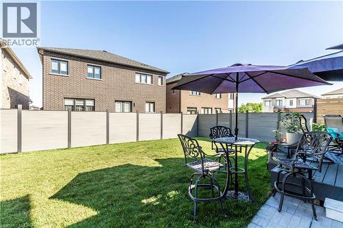 View of fenced backyard - 72 Pond View Gate, Waterdown, ON - Outdoor With Exterior