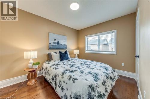 Bedroom featuring baseboards and dark wood-style floors - 5811 Page Crescent, Burlington, ON - Indoor Photo Showing Bedroom