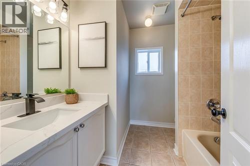 Bathroom with vanity, shower / tub combination, and light tile patterned floors - 5811 Page Crescent, Burlington, ON - Indoor Photo Showing Bathroom