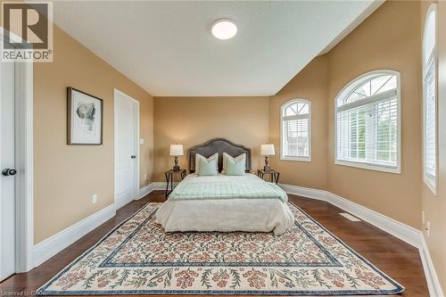 Bedroom featuring baseboards and dark wood finished floors - 5811 Page Crescent, Burlington, ON - Indoor Photo Showing Bedroom