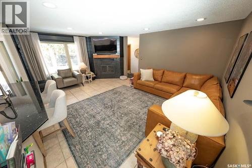 715 Emerald Bay, Saskatoon, SK - Indoor Photo Showing Living Room With Fireplace