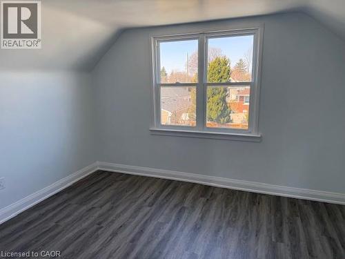 Additional living space featuring dark wood-style flooring - 322 Upper Gage Avenue, Hamilton, ON - Indoor Photo Showing Other Room