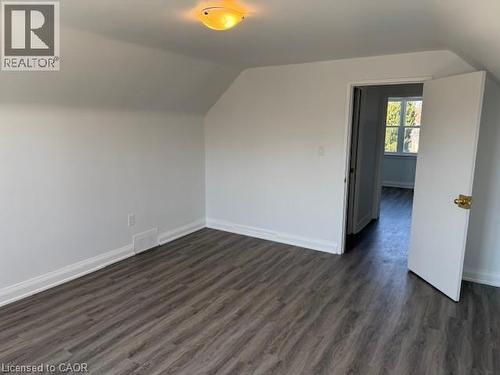 Bonus room with vaulted ceiling and dark wood finished floors - 322 Upper Gage Avenue, Hamilton, ON - Indoor Photo Showing Other Room