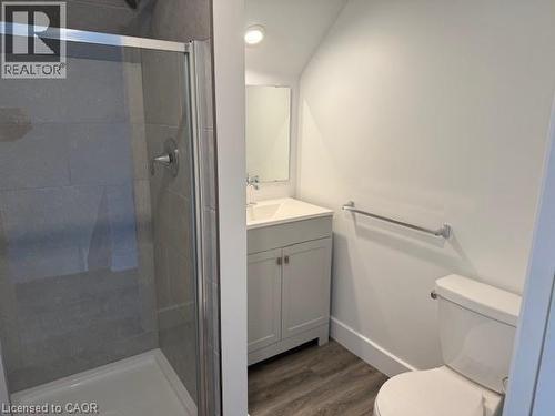 Bathroom featuring vanity, dark wood finished floors, a stall shower, and recessed lighting - 322 Upper Gage Avenue, Hamilton, ON - Indoor Photo Showing Bathroom