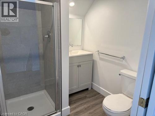 Full bathroom featuring vanity, dark wood finished floors, and a stall shower - 322 Upper Gage Avenue, Hamilton, ON - Indoor Photo Showing Bathroom