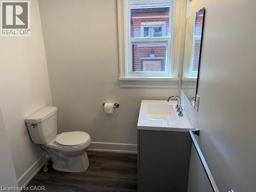 Bathroom with vanity and dark wood-style floors - 322 Upper Gage Avenue, Hamilton, ON - Indoor Photo Showing Bathroom