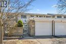 View of front of house featuring a gate, driveway, stone siding, and a garage - 55 Ralgreen Crescent, Kitchener, ON  - Outdoor 