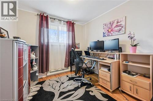Office featuring ornamental molding, light wood finished floors, and a baseboard radiator - 55 Ralgreen Crescent, Kitchener, ON - Indoor Photo Showing Office
